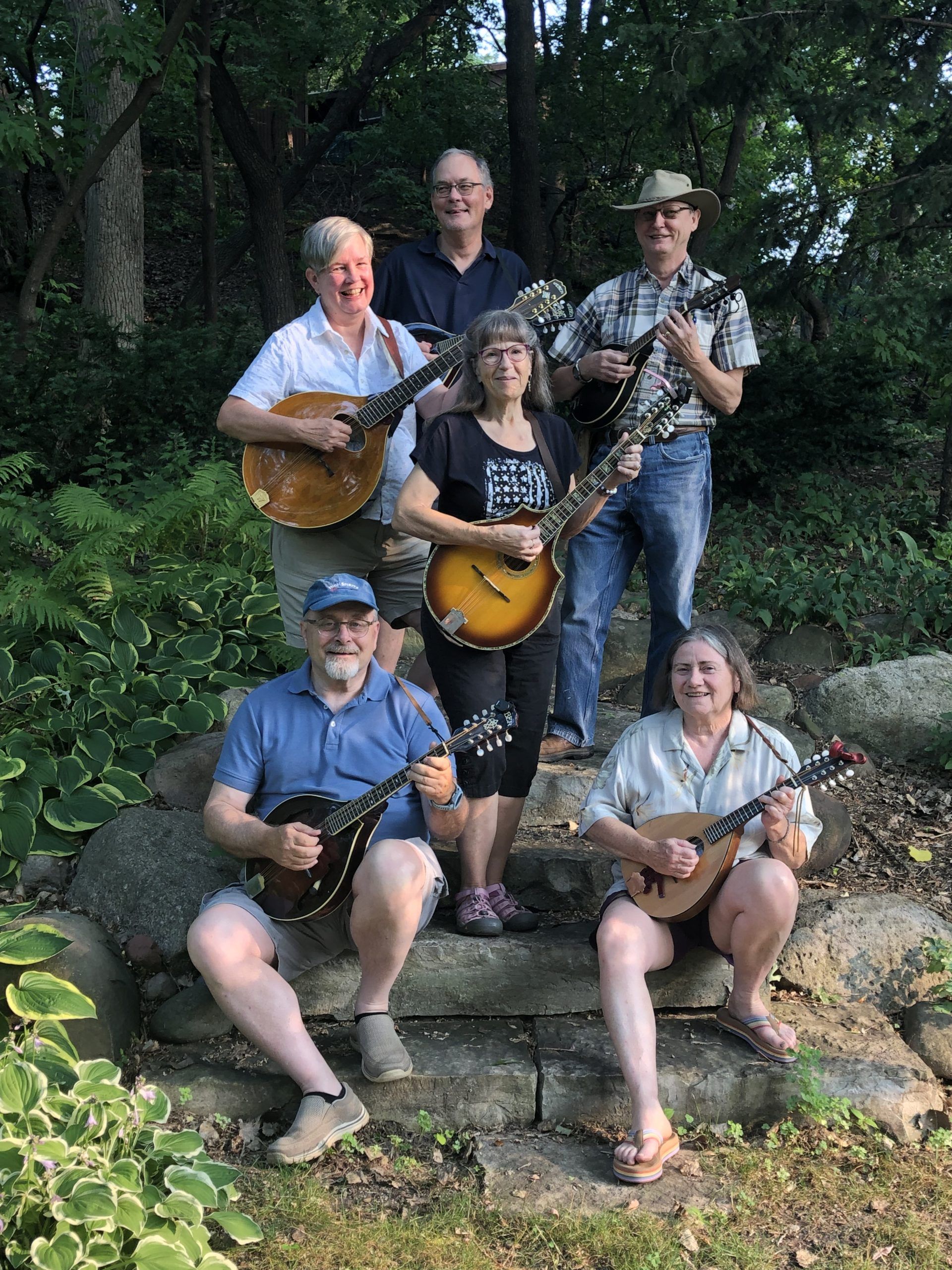 group of 6 MMO players posing after an outdoor rehearsal