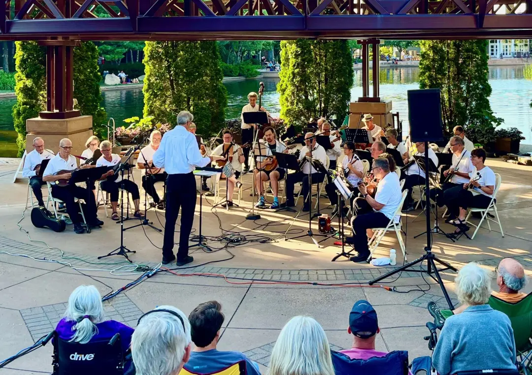 The Minnesota Mandolin Orchestra performs at Centennial Lakes in Edina, Minnesota.